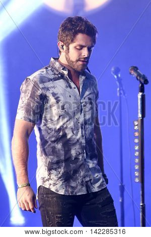 NEW YORK-SEPT 28: Country music artist Thomas Rhett performs at the iHeartRadio Album Release Party with Thomas Rhett on September 28, 2015 at the iHeartRadio Theater in New York City.