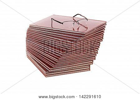 Books and glasses on a white background