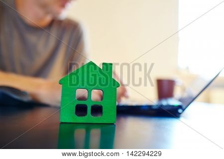 wooden house on the office table