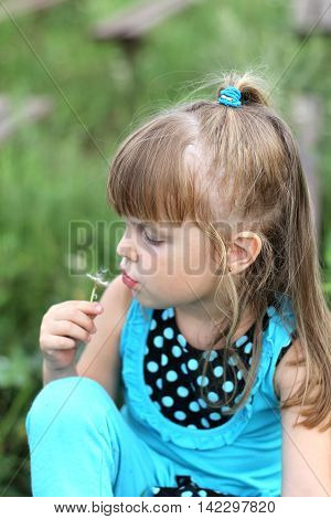 Little Girl With Long Hair Playing On Grass In Summer