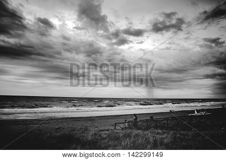 stormy sea beach black and white dramatic sky