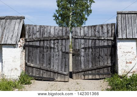 Closed old wooden gate in the countryside