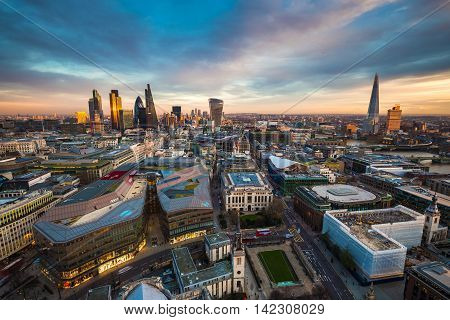 Skyline view of the famous financial bank district of London at magic hour. This view includes famous skyscrapers, office buildings and beautiful sky after sunset - UK, England