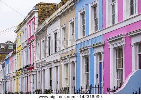 Traditional colorful brick houses of Notting Hill district near Portobello Road - London, UK