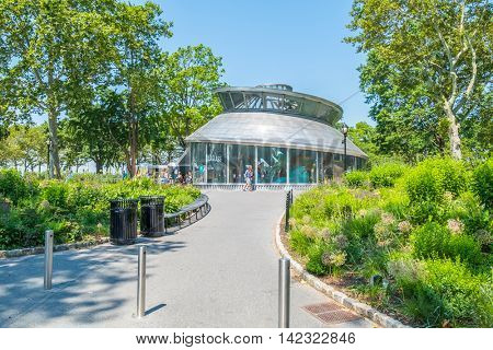 NEW YORK CITY, USA - JUNE 24, 2016: SeaGlass Carousel, a fish-themed carousel in Battery Park 