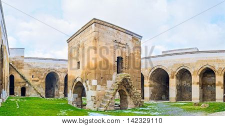AGZIKARAHAN TURKEY - JANUARY 19 2015: The small mosque (mescit) in the middle of Agzikarahan Caravan Saray with the stairs leading to the top floor on January 19 in Agzikarahan.
