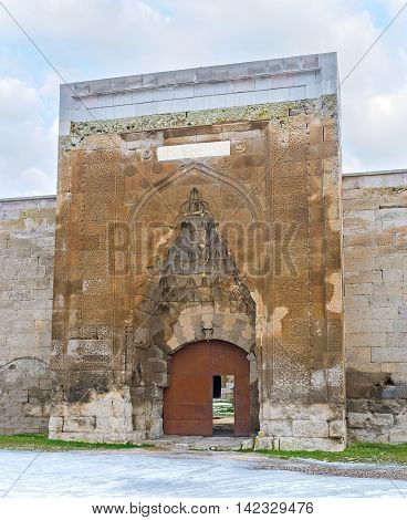 The portal of the medieval Agzikarahan Caravan Saray decorated with carved stone patterns Agzikarahan Cappadocia Turkey.