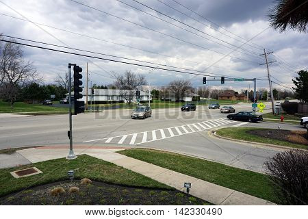 JOLIET, ILLINOIS / UNITED STATES - MARCH 19, 2016: A vehicle turns left onto the Wesmere Parkway from Caton Farm Road in Joliet.