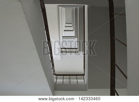 looking up stairwell building. Abstract architecture background.