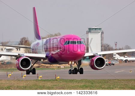 Kiev Ukraine - April 14 2012: Wizz Air Airbus A320 is taxiing to the runway for takeoff - closeup view