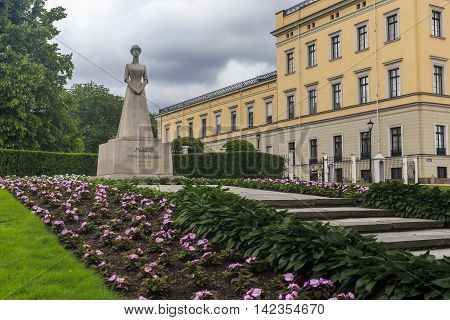 OSLO, NORWAY - JULY 1, 2016: This is monument to Norway's Queen Maud of Wales at the entrance to the park of the Royal Palace.