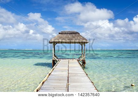 Wooden pier in Bel Ombre beach, Mauritius island