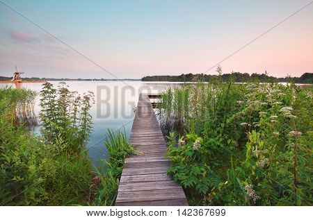 wooden pier on big lake in summer Groningen Netherlands