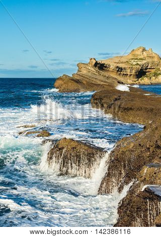 Waves being stop by the reef at Castlepoint New Zeaalnd.