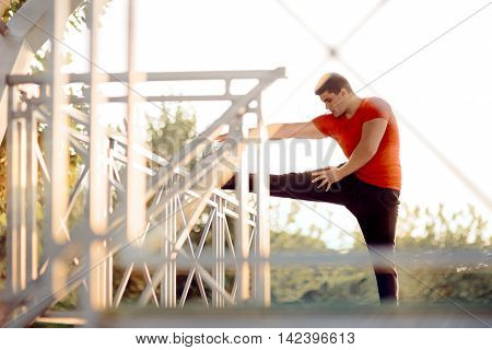 Athletic Man Stretching Before Workout Fitness Routine