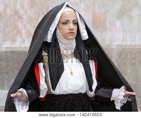 CAGLIARI, ITALY - May 1, 2014: 358 ^ Religious Procession of Sant'Efisio - Sardinia - portrait of a beautiful girl in traditional Sardinian costume