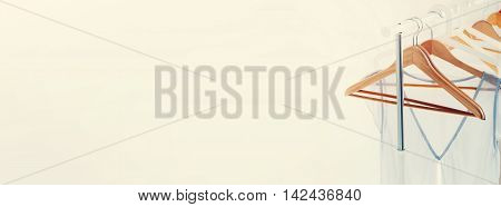 Open Rail Wooden Hangers Light Grey Dress Banner