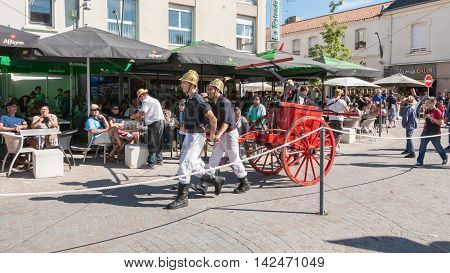 Antique Firefighters To Intervene With A Water Pump