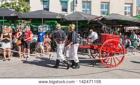 Antique Firefighters To Intervene With A Water Pump