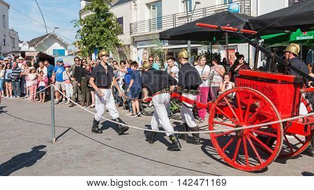 Antique Firefighters To Intervene With A Water Pump