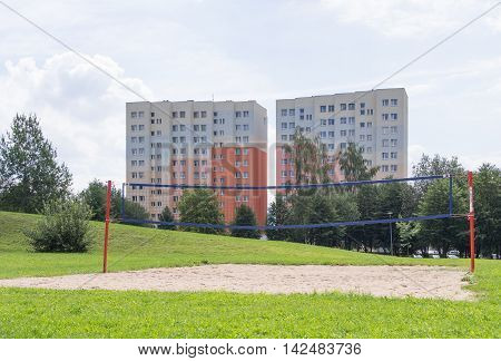JELENIA GORA POLAND - AUGUST 13 2016: beach volleyball field in front of an industrialized apartment block