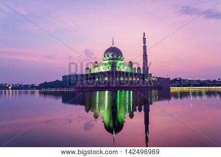 Putrajaya mosque between sunsire in Kuala Lumpur Malaysia. Pink mosque in Kuala Lumpur Malaysia.