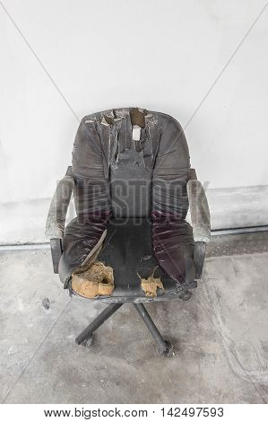 Black Office chair old damage leather .