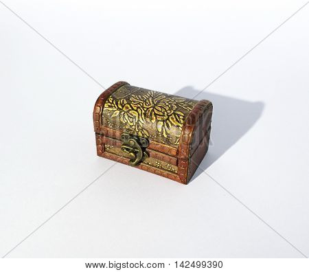 Ole wooden treasure chest in white background.