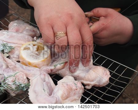 Cooking chicken wings on the grill. B-B-Q.