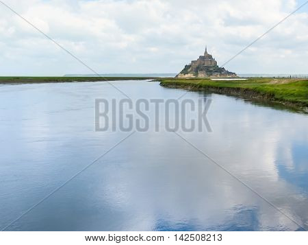 Couesnon river and Mont Saint-Michel - tidal island town and abbey. France
