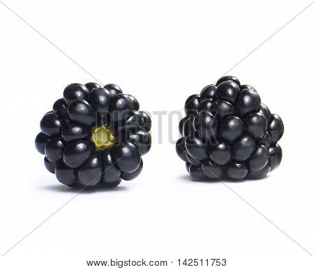 Two fresh blackberry fruits, isolated on white background.