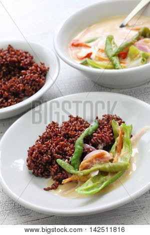 ema datshi (traditional chili cheese stew) with red rice,bhutanese cuisine