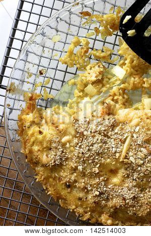 Salmon and whitebait quiche on a glass plate.