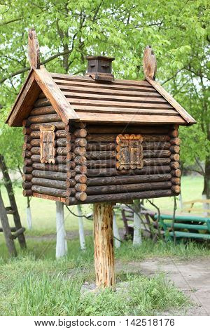 Toy house in the woods . A hut on chicken legs.