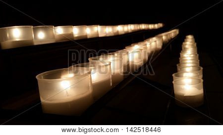 candles in a row to remember the dead and saints
