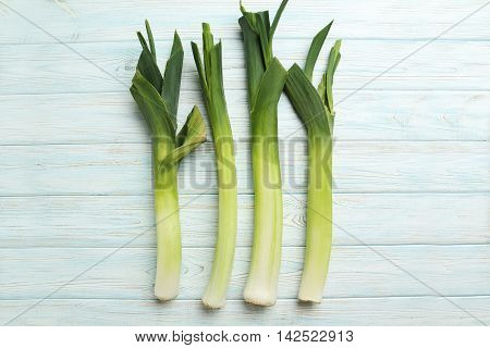 Green Leeks On A Blue Wooden Table
