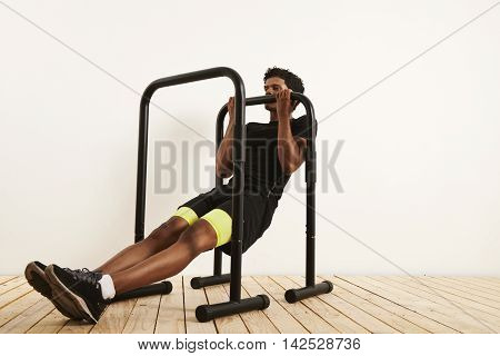 Young Black Athlete Doing Bodyweight Rows On Mobile Bars