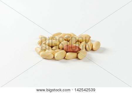 Heap of unsalted shelled peanuts