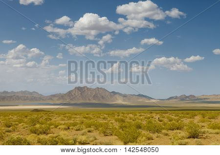 panoramic view death valley with some mountains on the back
