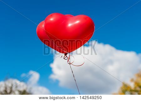 Valentine heart balloon against blue sky background