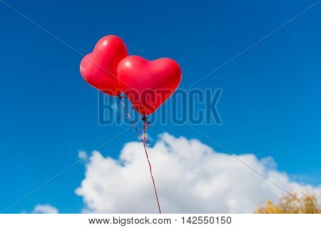 Valentine heart balloon against blue sky background