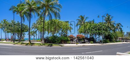 HONOLULU, USA - AUG 8: Kalakaua Avenue along Waikiki beach on August 8, 2016 in Honolulu, Usa. Waikiki beach is neighborhood of Honolulu, best known for white sand and surfing.