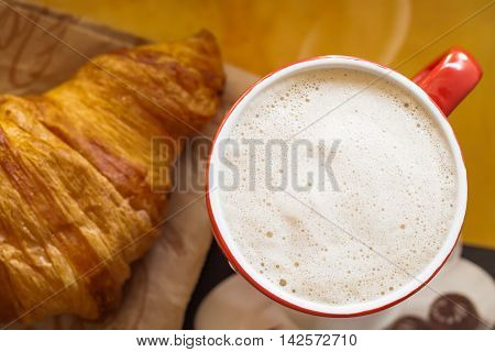 Red Coffee Cup And Croissant, Top View