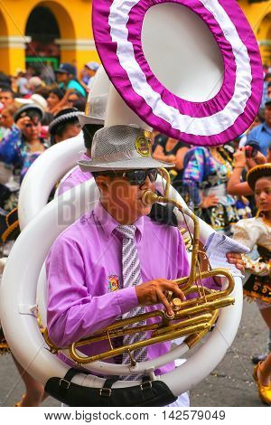 LIMA PERU-FEBRUARY 1: Unidentified man plays sousaphone during Festival of the Virgin de la Candelaria on February 12015 in Lima Peru. Core of the festival is dancing performed by dance schools