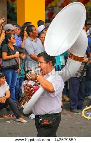 LIMA PERU-FEBRUARY 1: Unidentified man plays sousaphone during Festival of the Virgin de la Candelaria on Februry 12015 in Lima Peru. Core of the festival is dancing performed by different dance schools