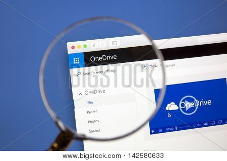 Ostersund, Sweden - Aug 14, 2016: Microsoft OneDrive website under a magnifying glass. Microsoft OneDrive is a file hosting service.