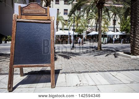 Empty tabloid offering food for terrace restaurants Granada Spain
