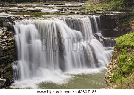 The Genesee River pours over Lower Falls a waterfall in New York's Letchworth State Park.