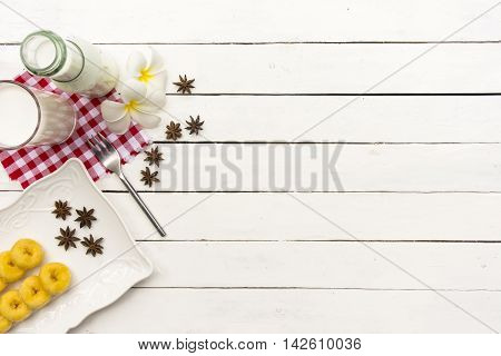 Donut dessert and milk bottle and milk glass  on Red checkered fabric .Meal or breakfast hi-vitamin and calcium.001