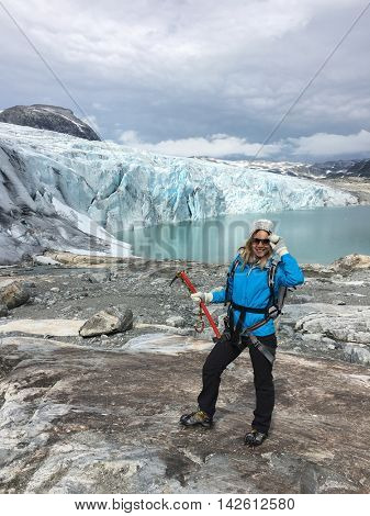 Woman climber standing near Jostedalsbreen glacier. Norway.